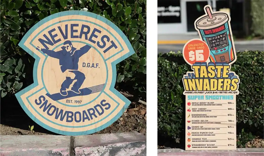 Two retro-style signs - one featuring a snowboarder logo for ’Neverest Snowboards’ and another showing a drink cup design for ’Taste Invaders’ menu.