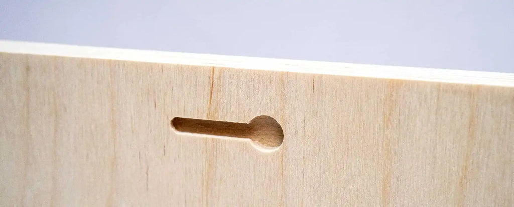 Wooden dowel peg inserted into a hole.